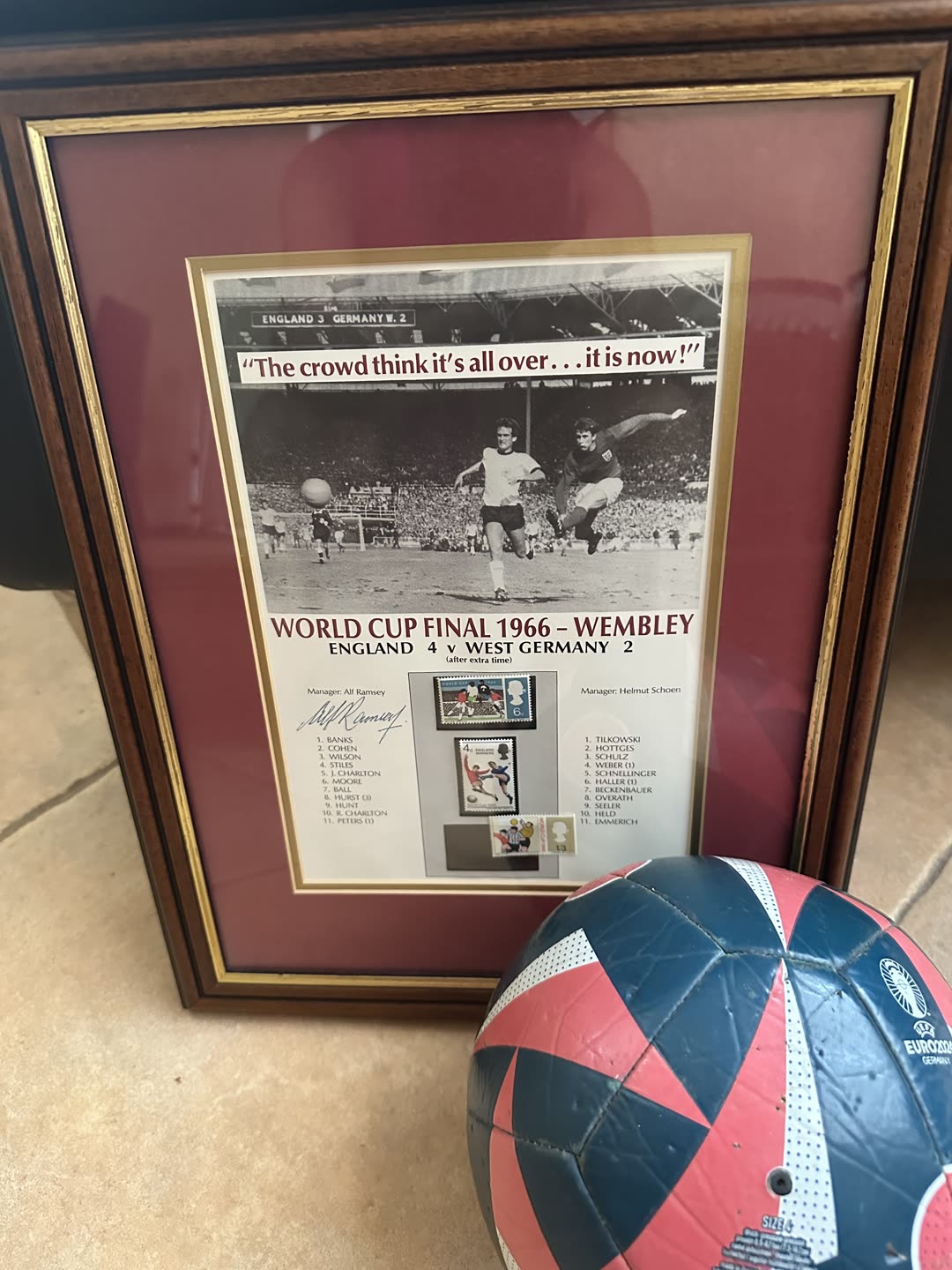 Framed 1966 World Cup Final commemorative presentation signed by Sir Alf Ramsey, with a football for scale